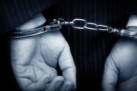 closeup of person in handcuffs