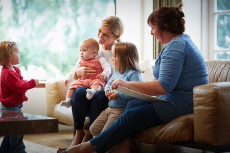 social worker meeting with family in their home