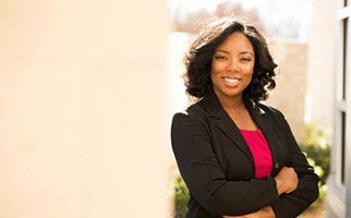 smiling woman with arms crossed