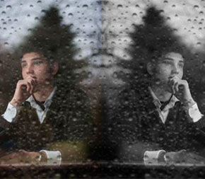 mirror image of pensive man