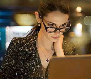 woman doing research on computer