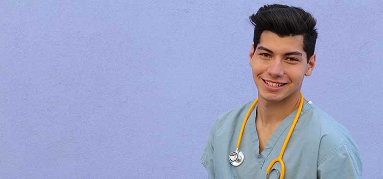 smiliing male nurse with stethoscope