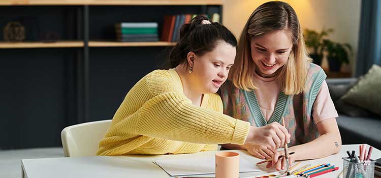 art therapist with client who is painting