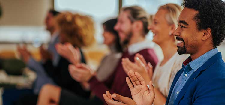 professional therapist group clapping after listening to speaker
