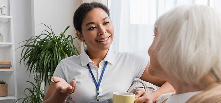 human services case worker pays a call on senior citizen